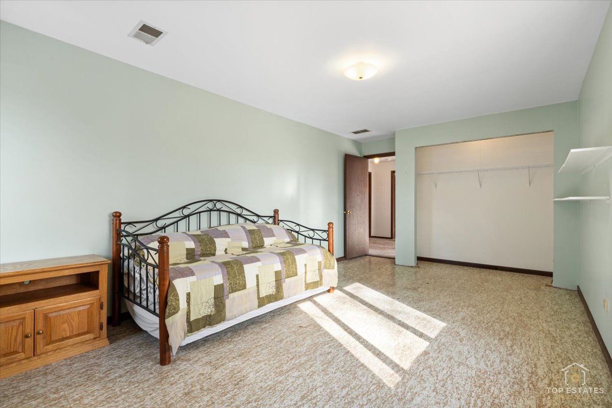 2302 Fulle Street Rolling Meadows, IL 60008 - Photo 30 of 48 a view of a bedroom with bed and a window