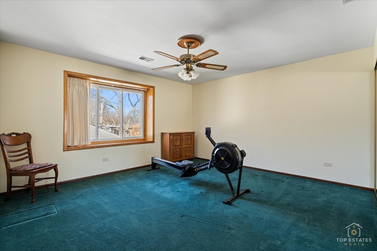 2302 Fulle Street Rolling Meadows, IL 60008 - Photo 32 of 48 a room with gym equipment and a window