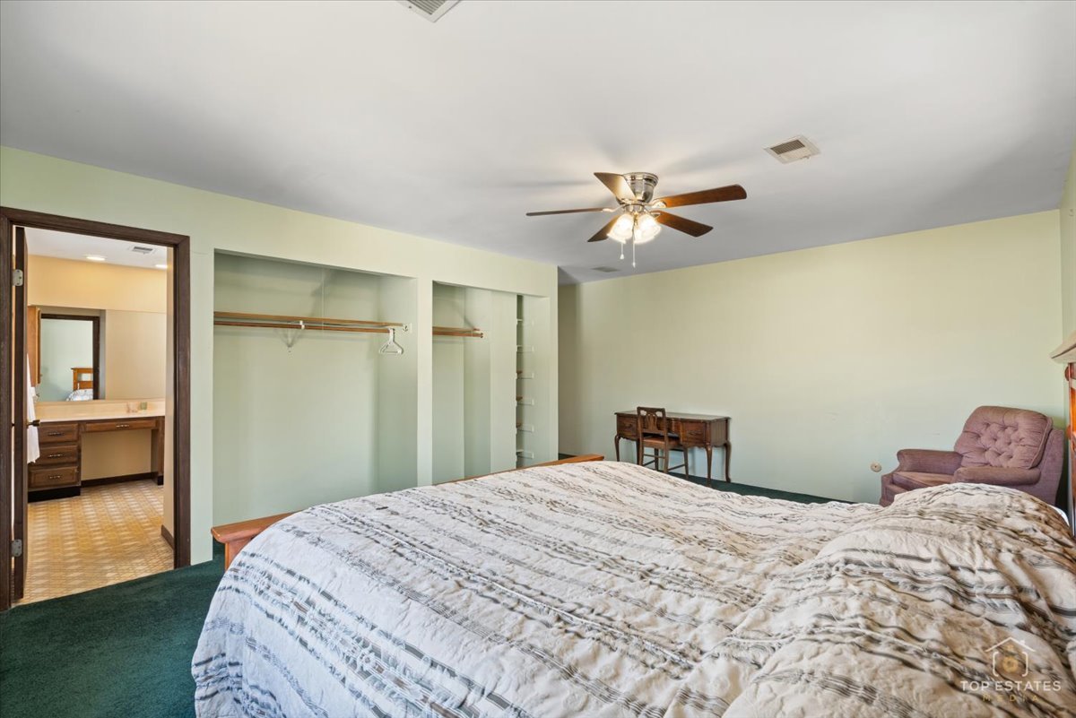 2302 Fulle Street Rolling Meadows, IL 60008 - Photo 8 of 48 a bedroom with a large bed and a chandelier
