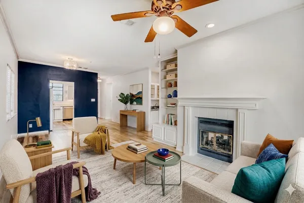 a living room with furniture and a fireplace