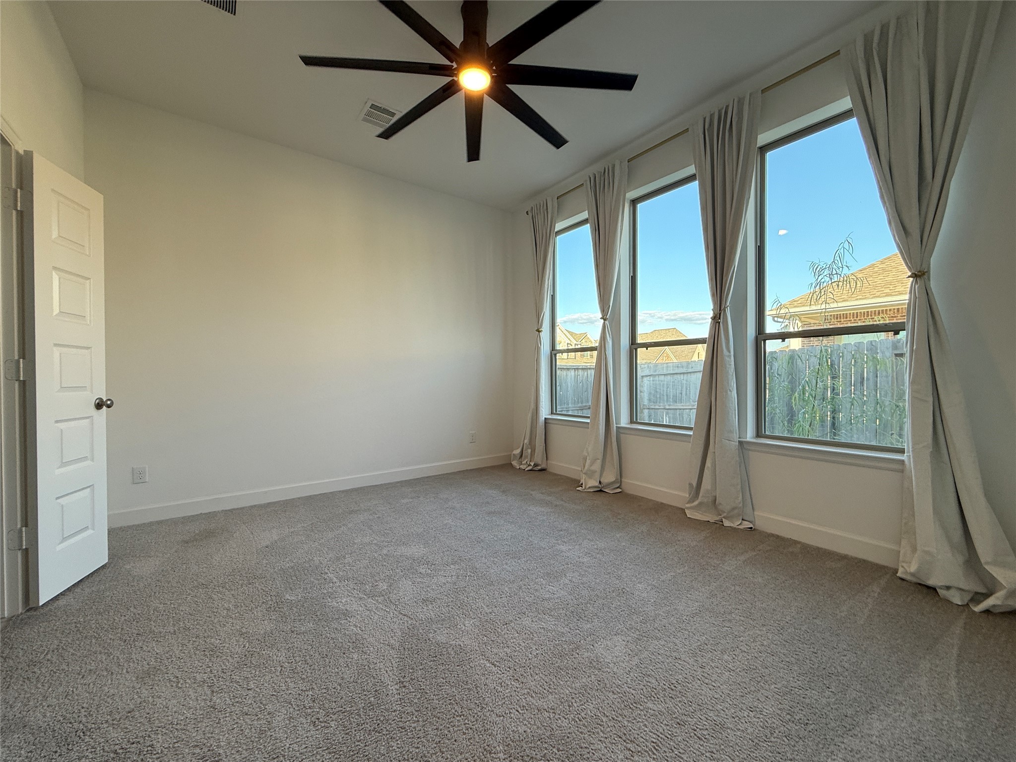 1354 Lakeside Crk Road Magnolia, TX 77354 - Photo 13 of 26 an empty room with windows and entrance