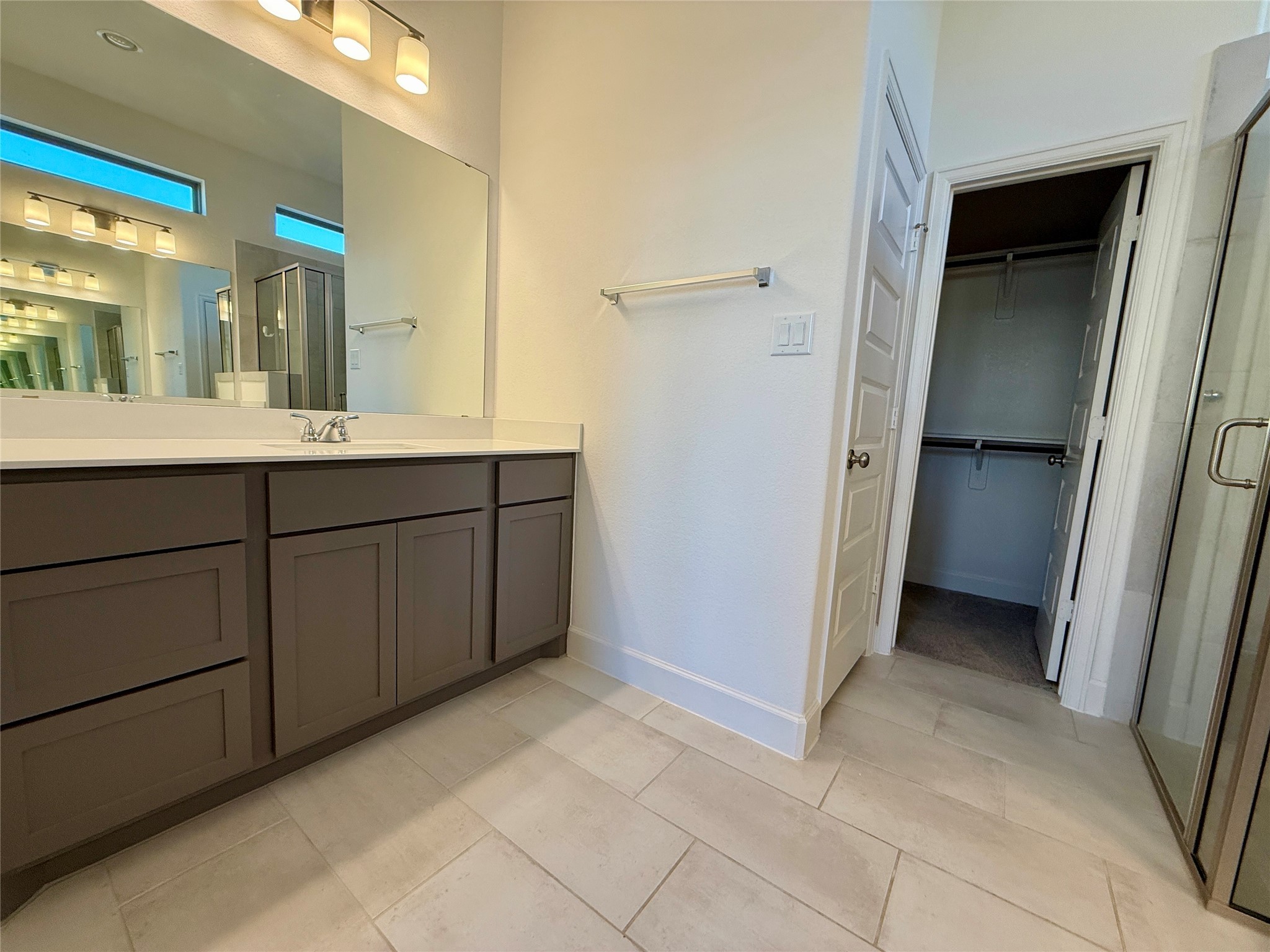 1354 Lakeside Crk Road Magnolia, TX 77354 - Photo 15 of 26 a spacious bathroom with a double vanity sink and a mirror