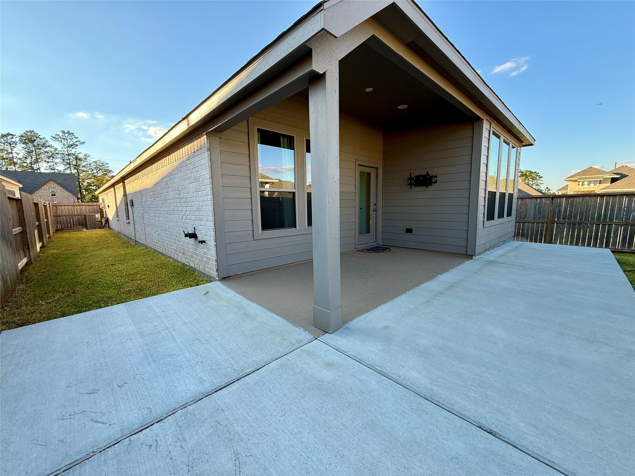 1354 Lakeside Crk Road Magnolia, TX 77354 - Photo 25 of 26 a view of a small house with backyard