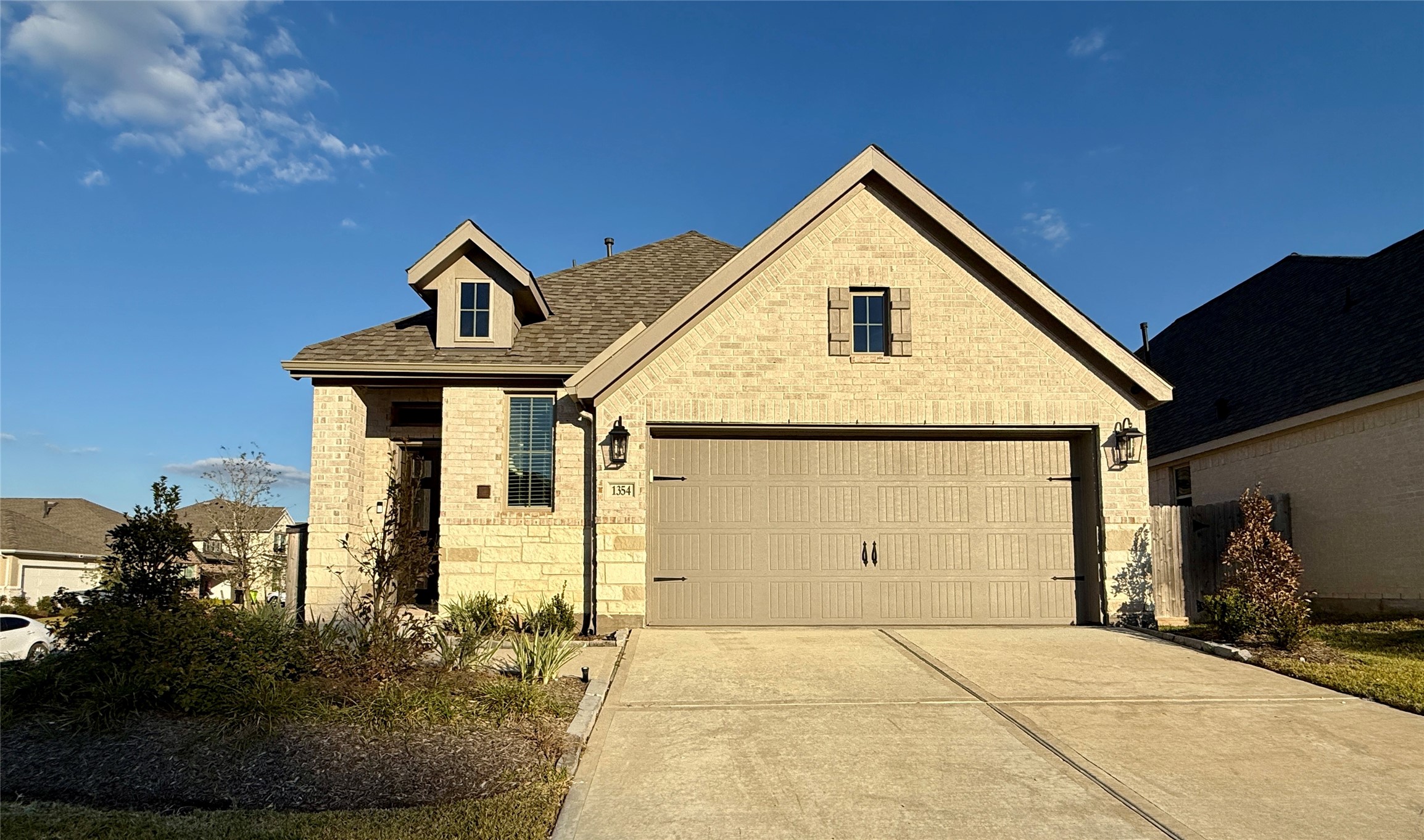 1354 Lakeside Crk Road Magnolia, TX 77354 - Photo 4 of 26 a front view of a house with garden