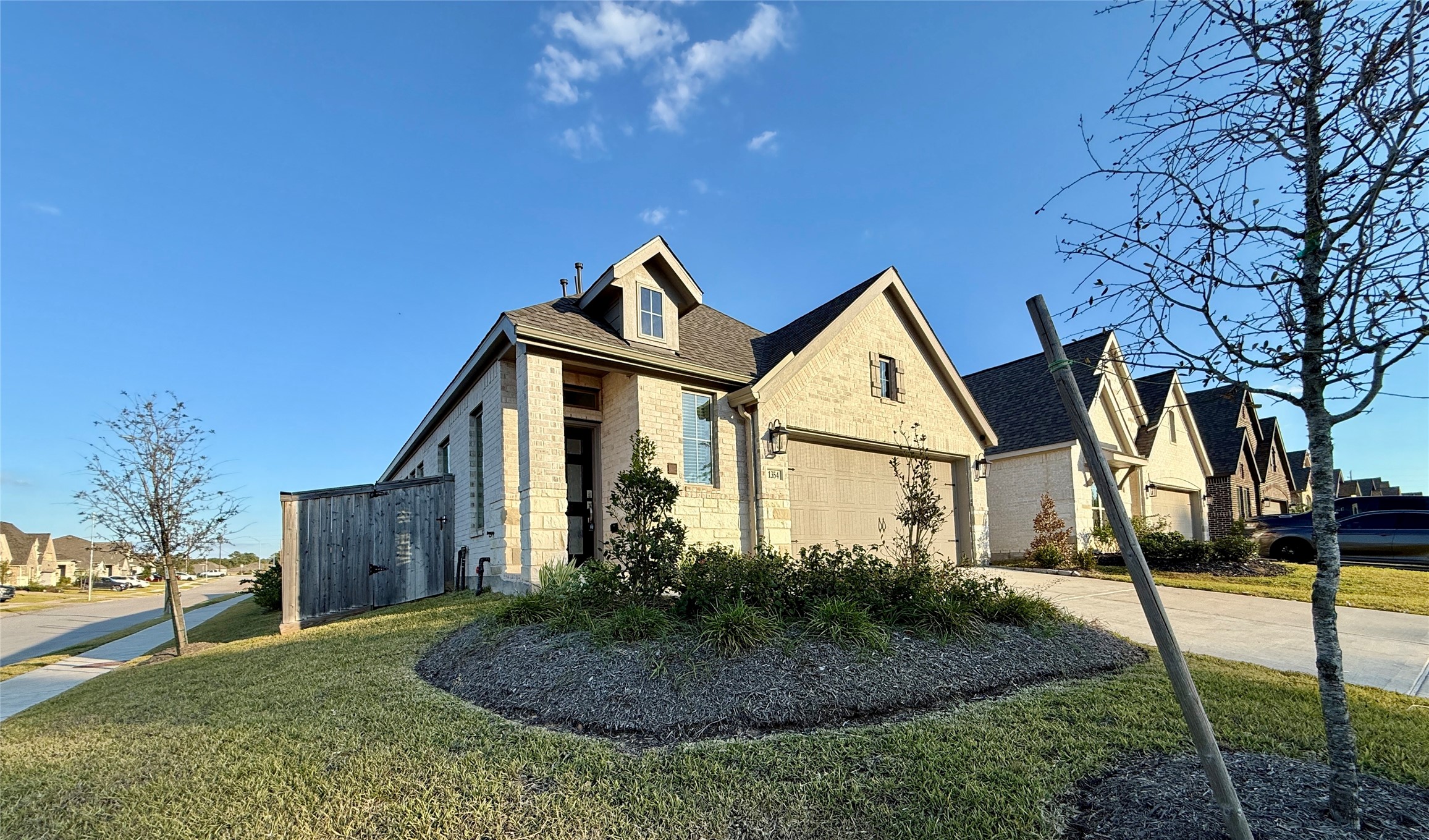 1354 Lakeside Crk Road Magnolia, TX 77354 - Photo 6 of 26 a front view of a house with garden