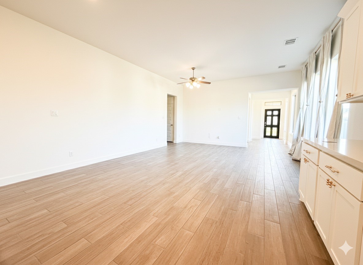 1354 Lakeside Crk Road Magnolia, TX 77354 - Photo 8 of 26 an empty room with wooden floor and windows
