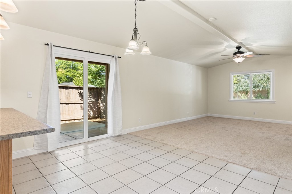 38 Kobe Loop Chico, CA 95973 - Photo 8 of 38 an empty room with windows and chandelier fan