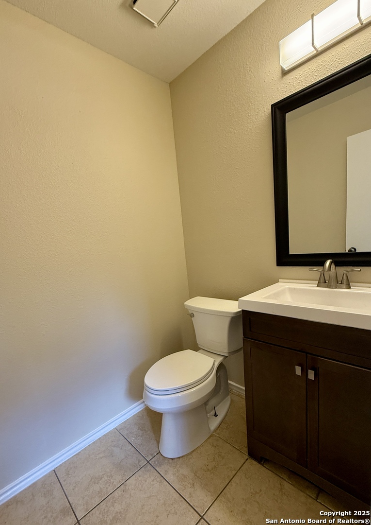 821 Dimrock Schertz, TX 78154 - Photo 11 of 20 a bathroom with a sink and a toilet