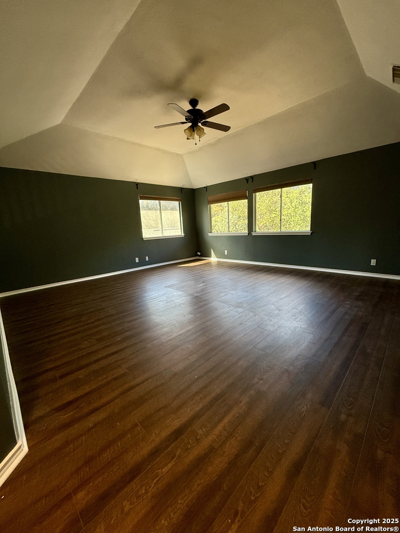 821 Dimrock Schertz, TX 78154 - Photo 13 of 20 an empty room with wooden floor and windows