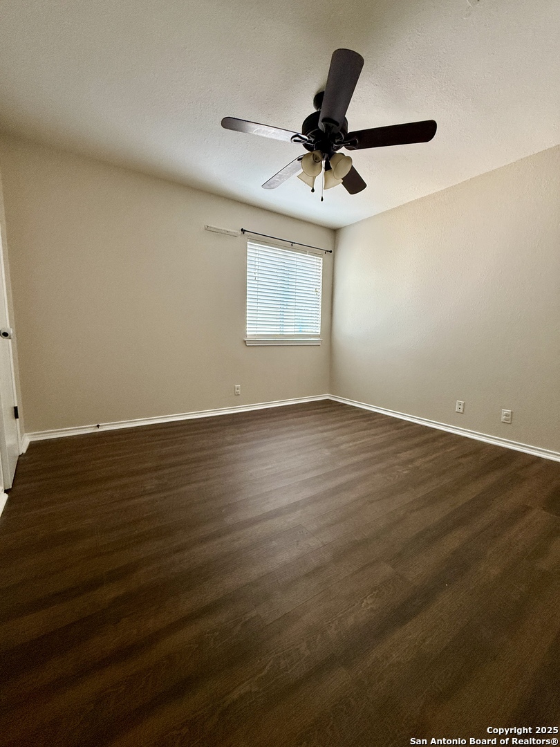 821 Dimrock Schertz, TX 78154 - Photo 16 of 20 a view of room with wooden floor and window