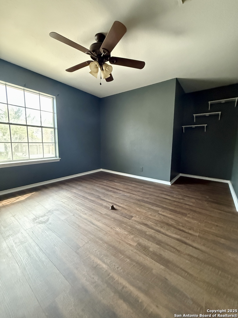 821 Dimrock Schertz, TX 78154 - Photo 17 of 20 an empty room with wooden floor and windows