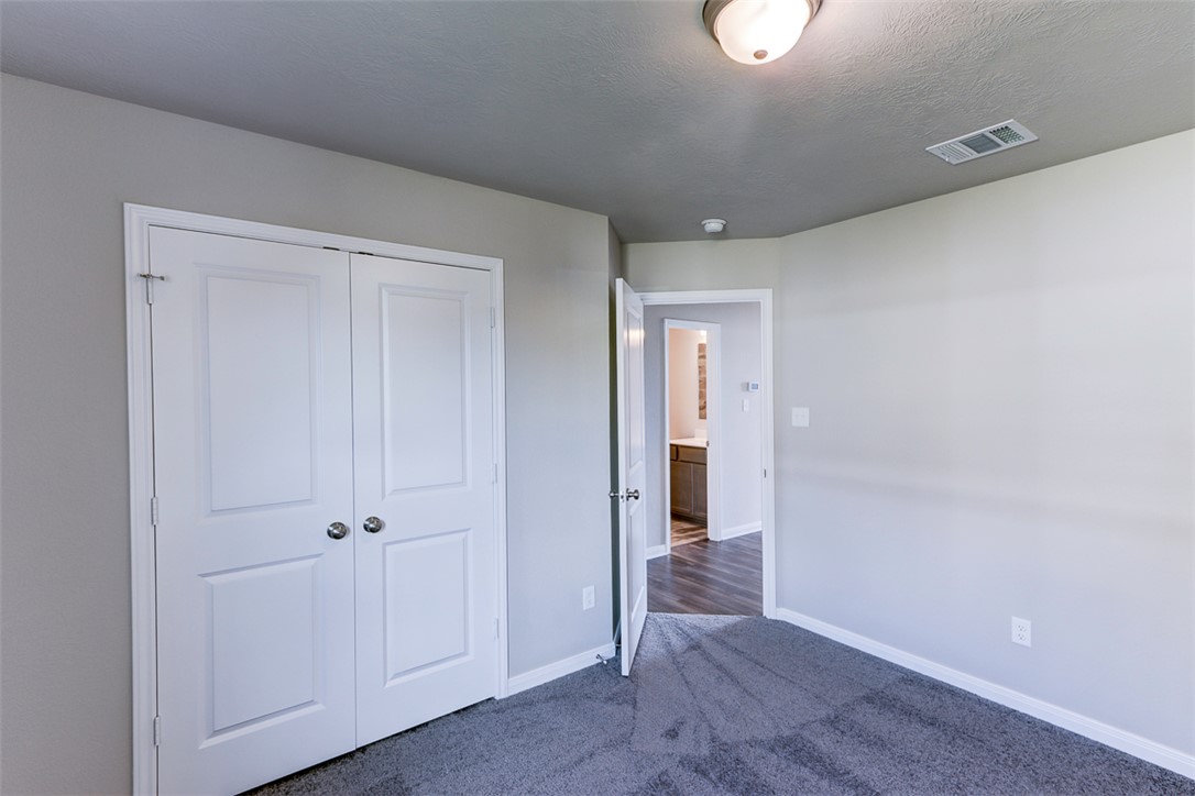 1937 Viva Road Bryan, TX 77807 - Photo 13 of 25 a view of a hallway with wooden floor and closet