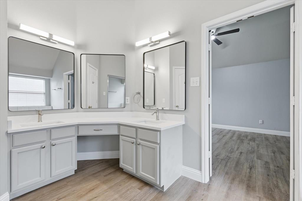 2616 Hollow Ridge Drive Denton, TX 76210 - Photo 19 of 31 Dual vanity bathroom featuring light-toned cabinetry, light countertops, and individual rectangular mirrors