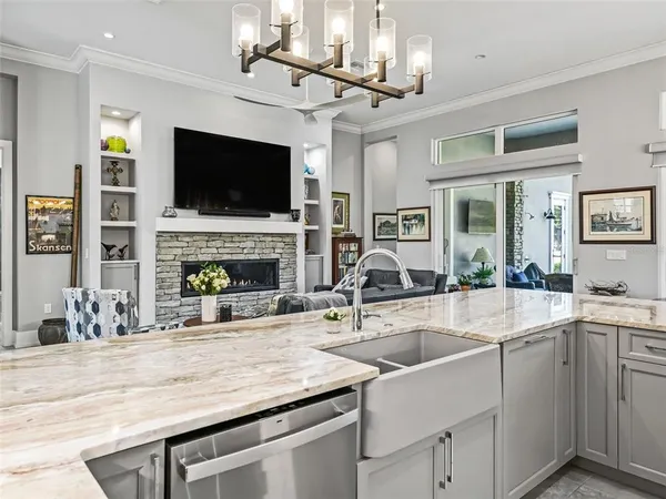 a bathroom with a granite countertop sink a large mirror and a bathtub