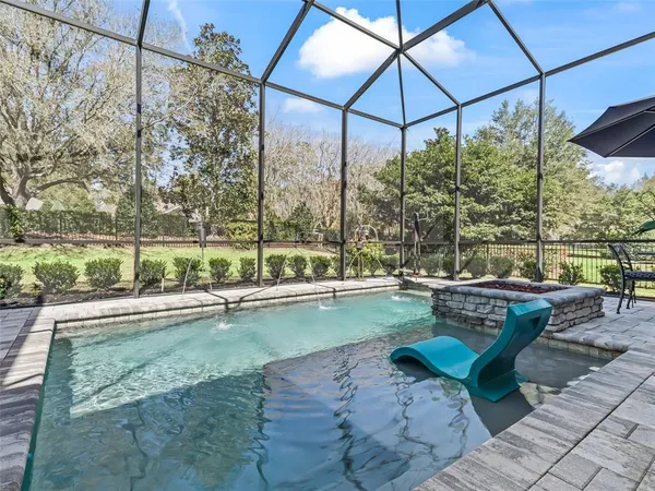 an aerial view of a house with swimming pool