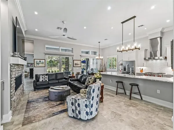 a living room with furniture fireplace and a flat screen tv