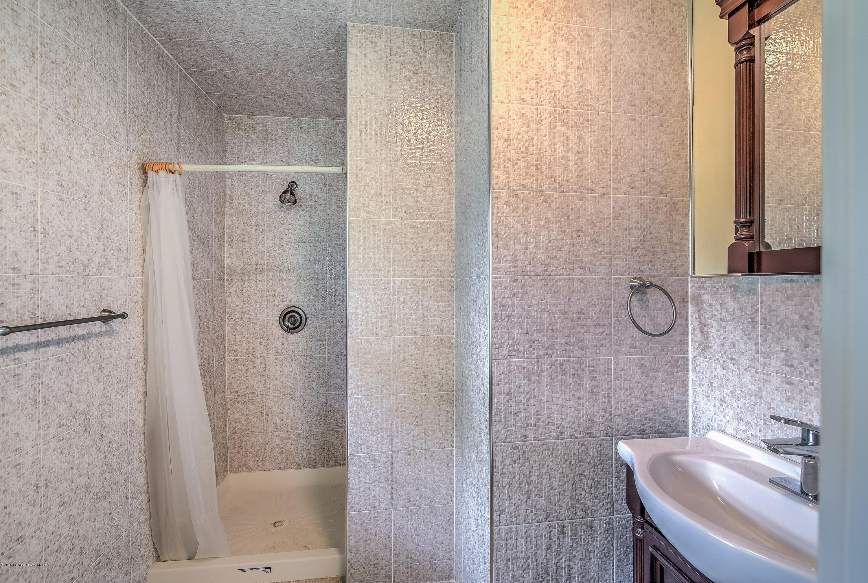 2 Nolan Road Allentown, NJ 08501 - Photo 21 of 26 a bathroom with a granite countertop shower and a sink