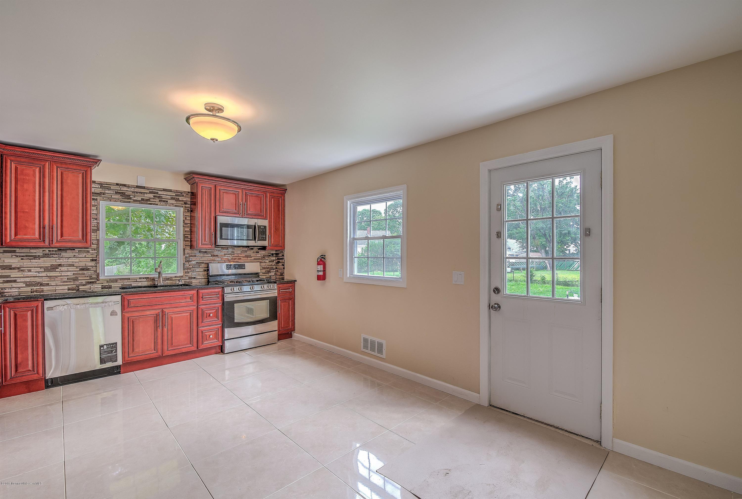 2 Nolan Road Allentown, NJ 08501 - Photo 23 of 26 a open kitchen with granite countertop a stove top oven sink and cabinets