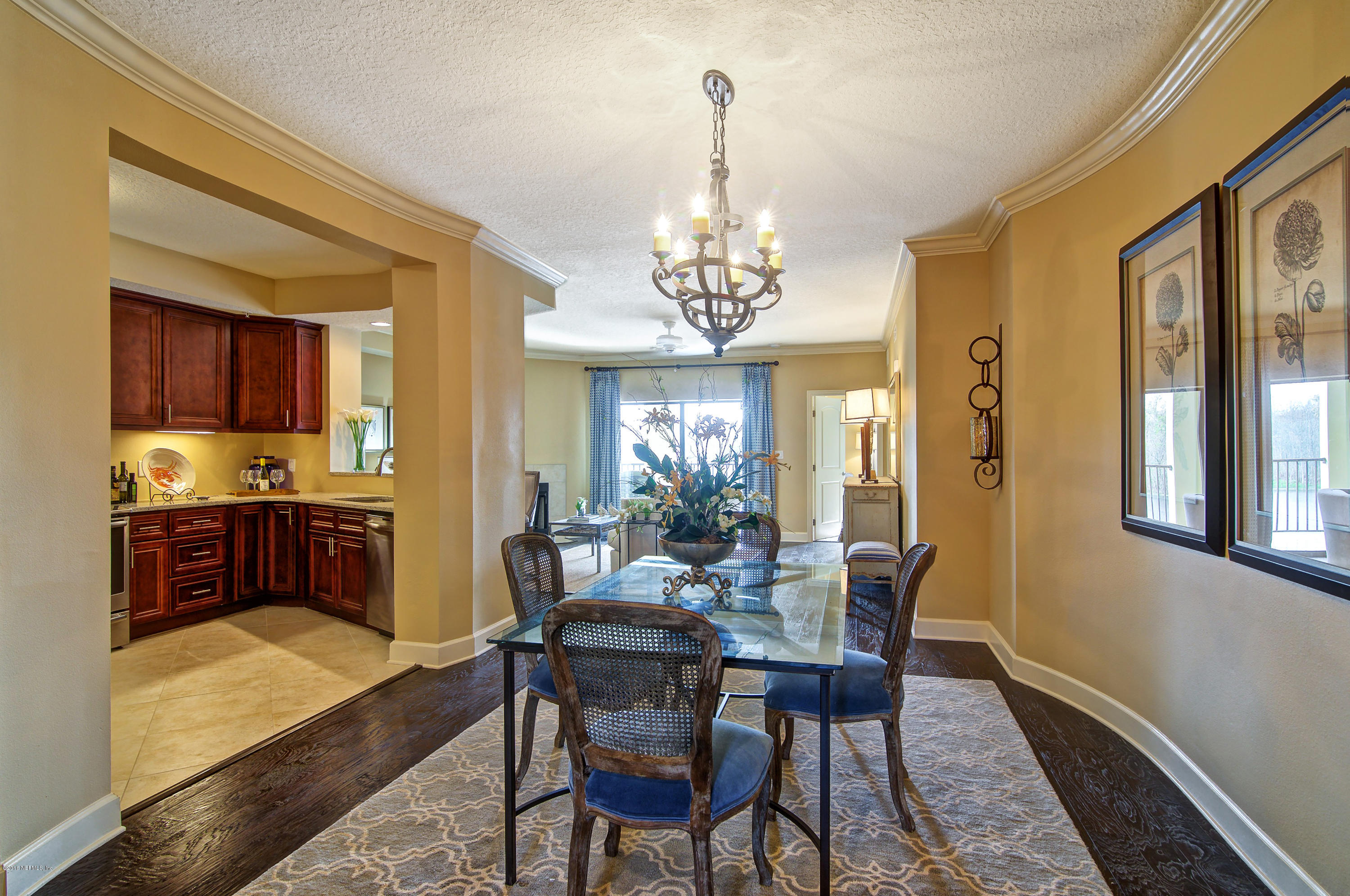 3958 Baymeadows Road, Unit 2602 Jacksonville, FL 32217 - Photo 4 of 14 a view of a dining room with furniture window and wooden floor