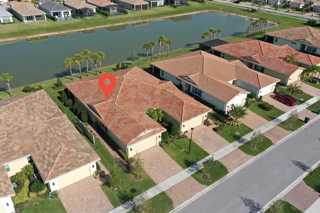 an aerial view of a house with a lake view