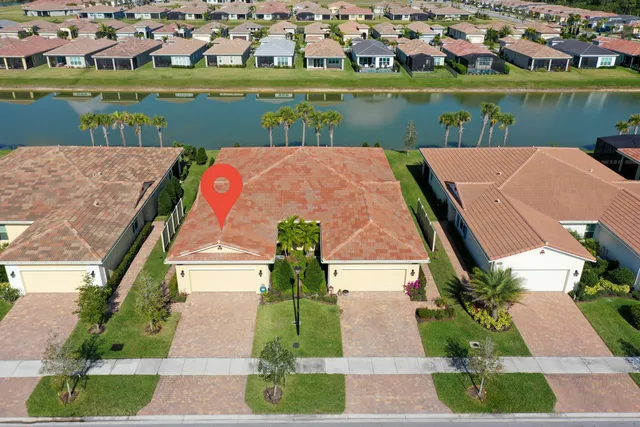 an aerial view of houses with trees
