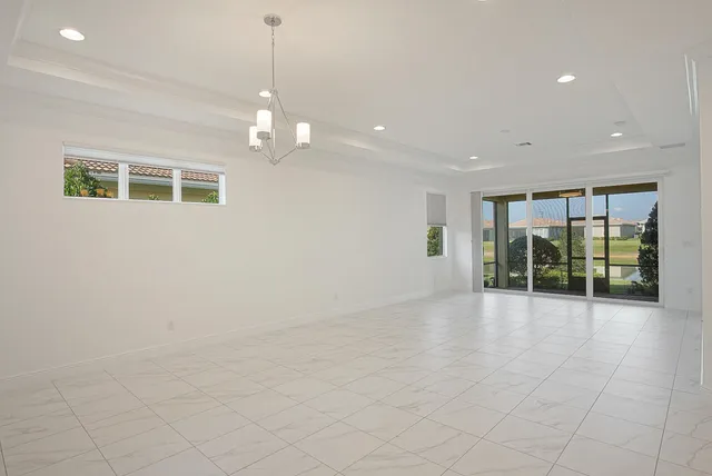 a view of an empty room with glass door