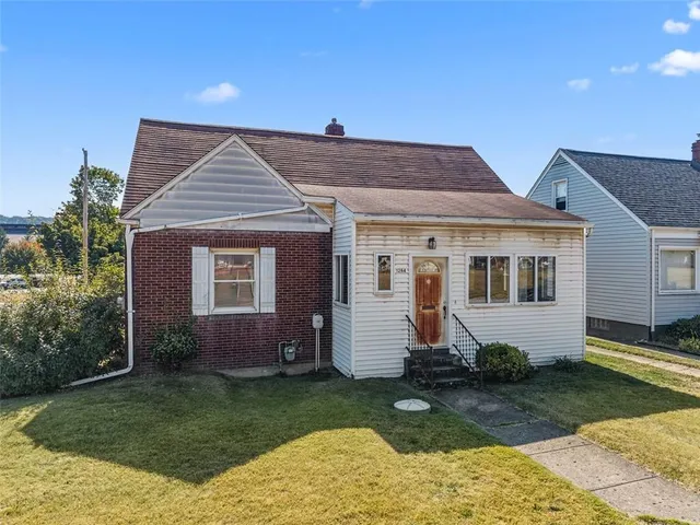 front view of a house with a yard