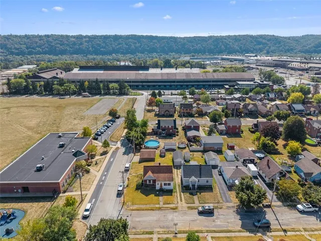 an aerial view of residential building with lake view and mountain view