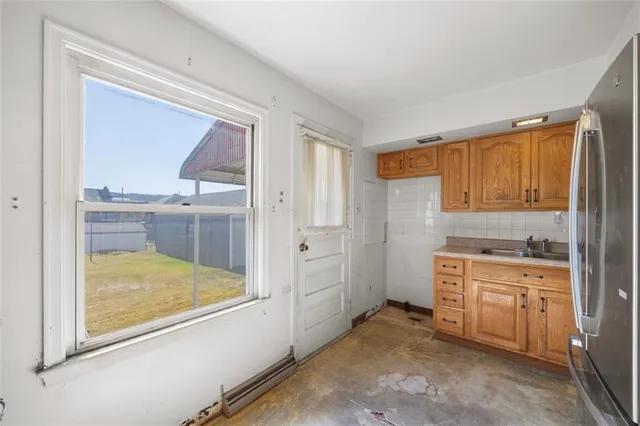 a view of a kitchen with a sink cabinets and a window