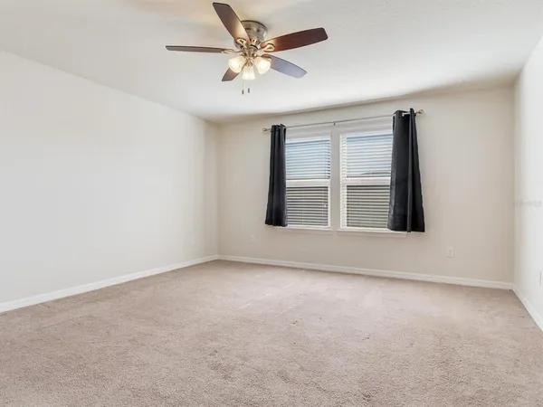 a bathroom with a mirror and a shower