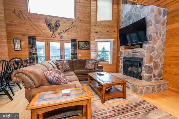 a living room with furniture and a table