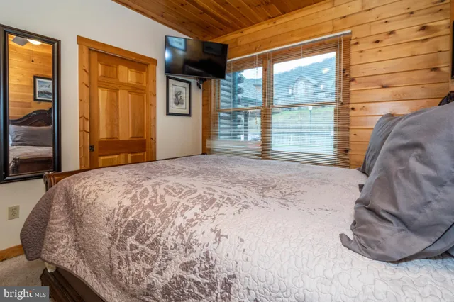 a bathroom with a sink a toilet and shower curtain