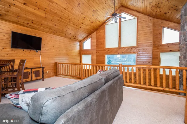 a bedroom with bed and a window