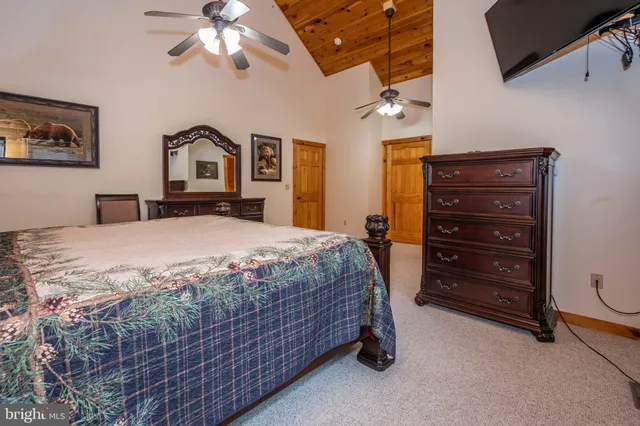 a bathroom with a granite countertop sink a mirror and a bathtub
