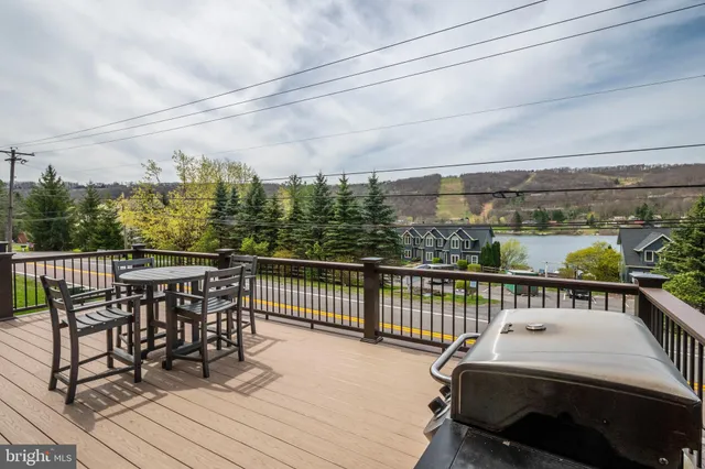 a view of a balcony with furniture