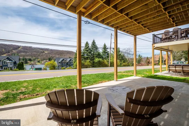a view of an outdoor space with porch and furniture
