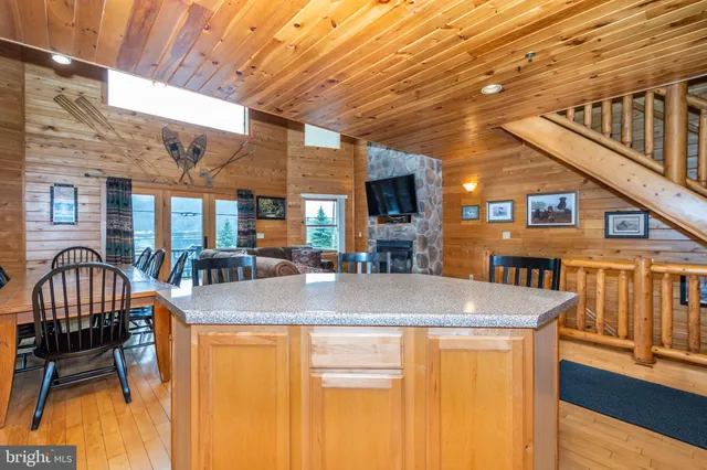 a view of a patio with a table and chairs