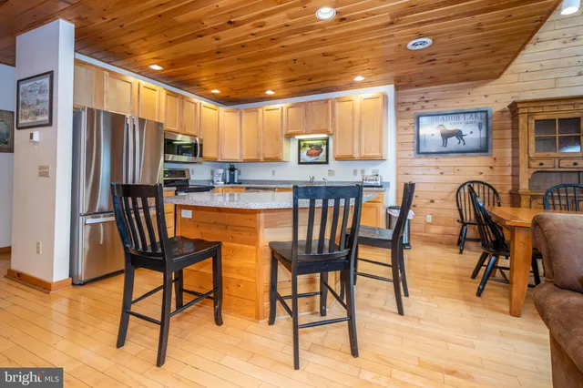 a view of a dining room with furniture and a wooden floor