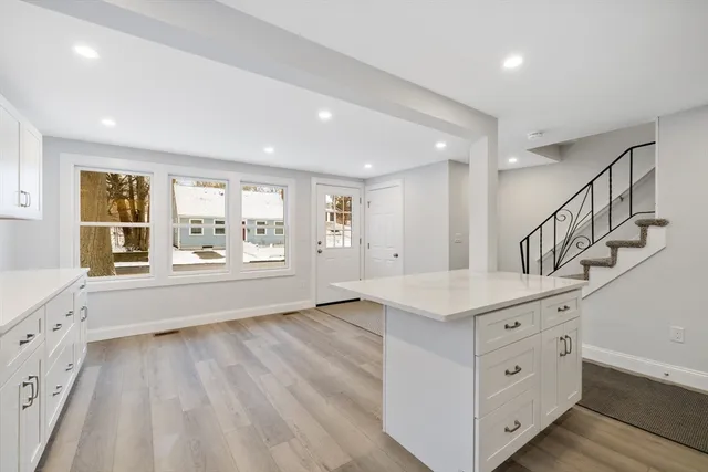 a view of room with window and wooden floor