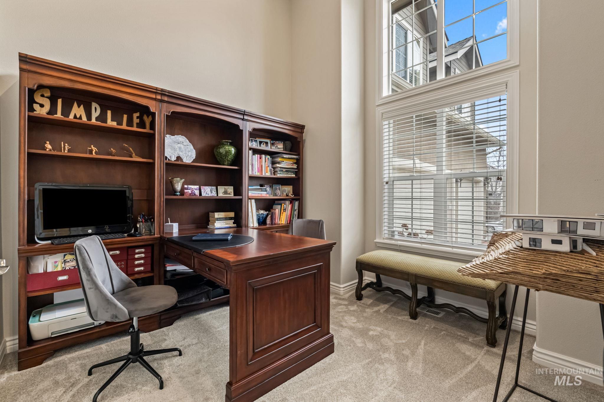 4235 Trekker Rim Drive East Boise, ID 83716 - Photo 13 of 33 Home office featuring light colored carpet and a high ceiling