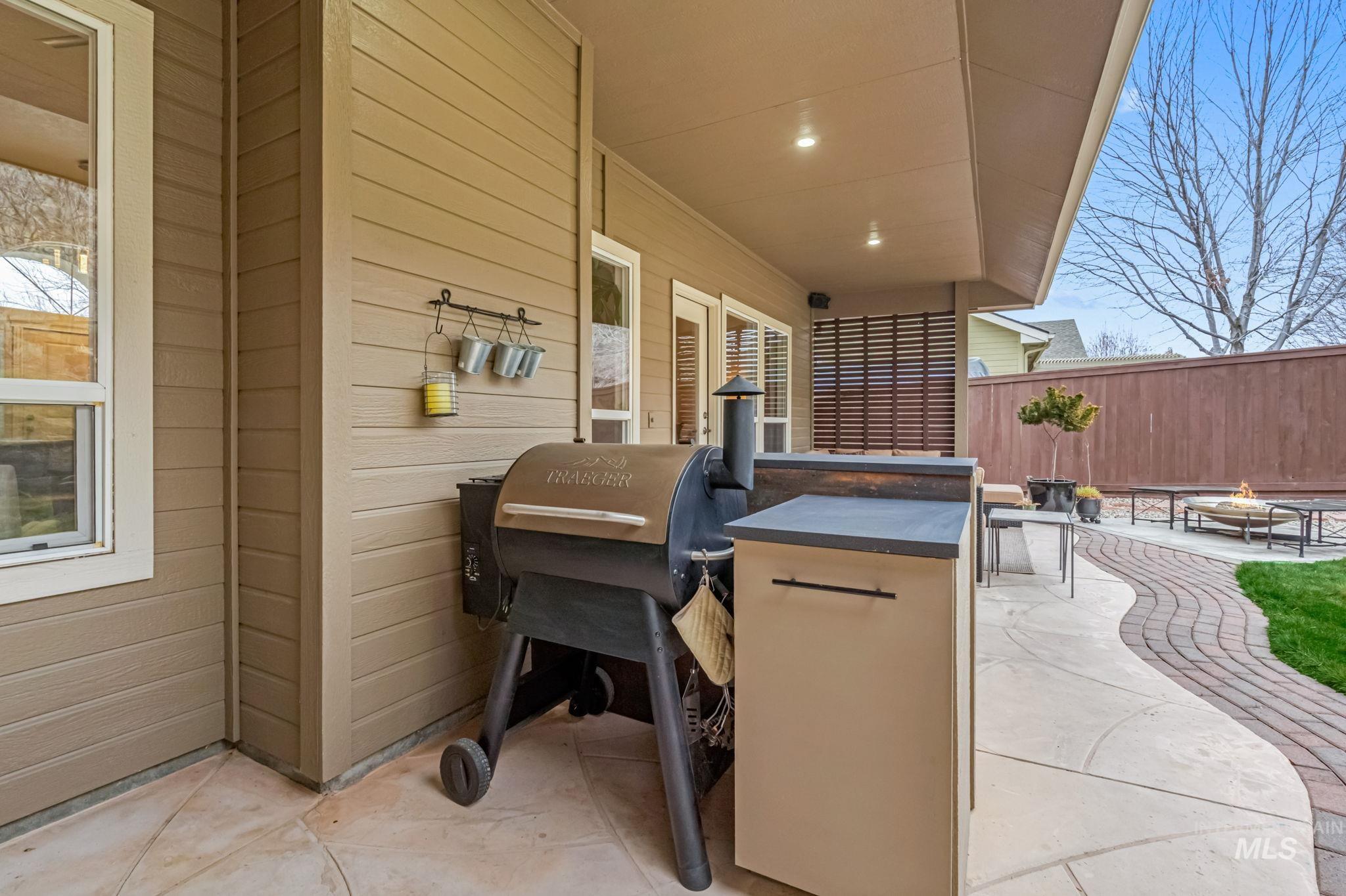 4235 Trekker Rim Drive East Boise, ID 83716 - Photo 24 of 33 View of patio / terrace featuring a fire pit and a grill