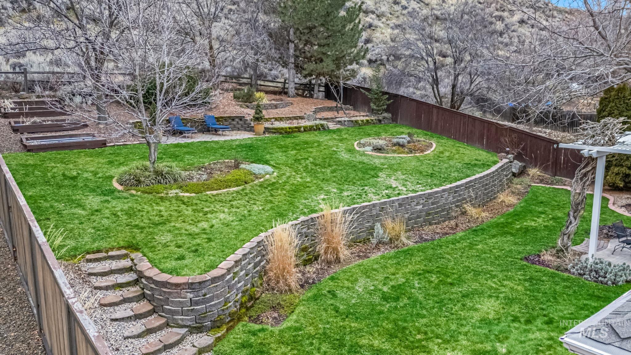4235 Trekker Rim Drive East Boise, ID 83716 - Photo 29 of 33 Fenced backyard with a patio area