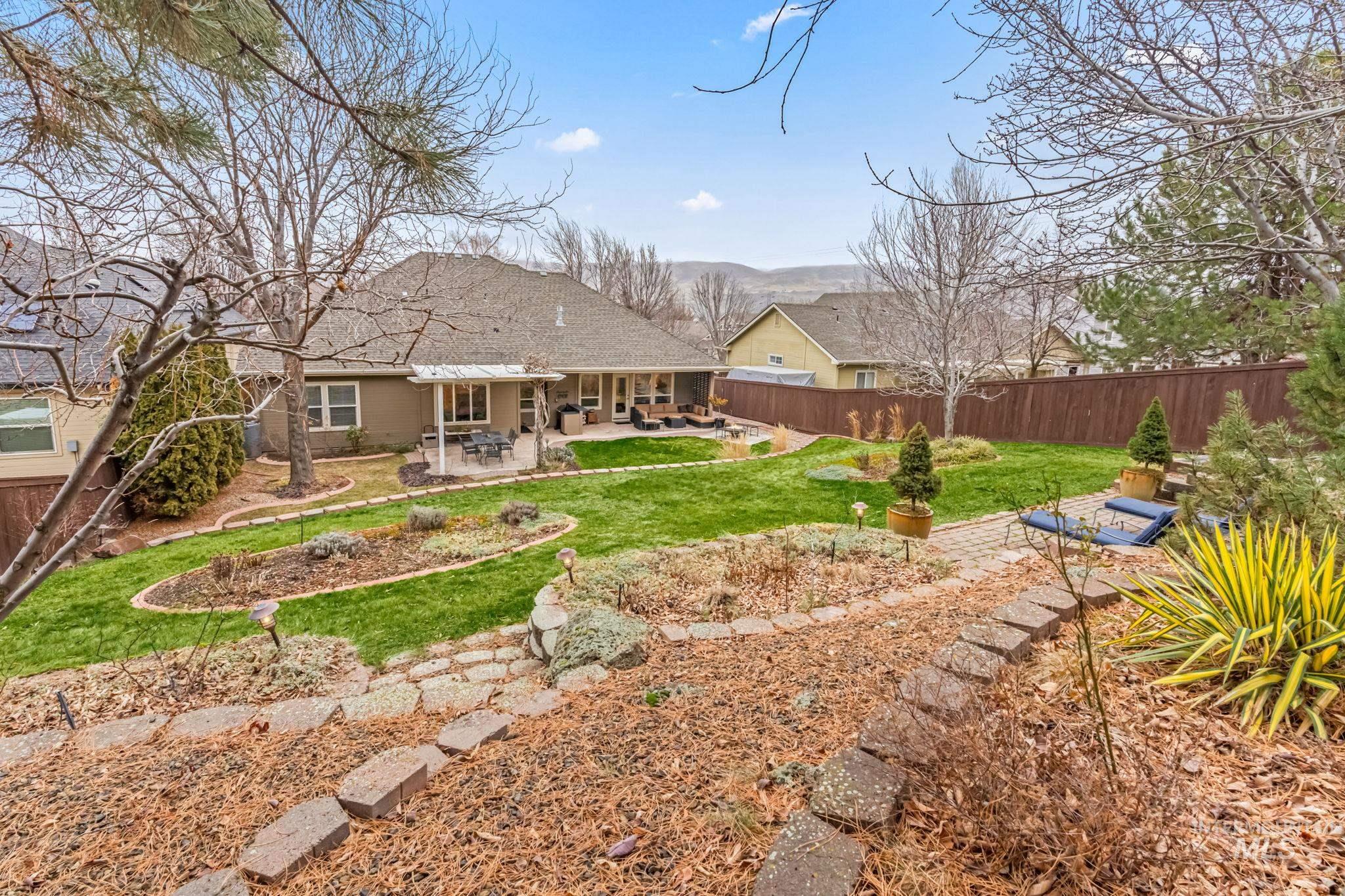 4235 Trekker Rim Drive East Boise, ID 83716 - Photo 30 of 33 Fenced backyard with a patio area