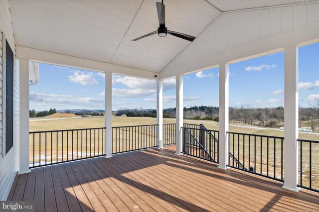 a view of a balcony with wooden floor
