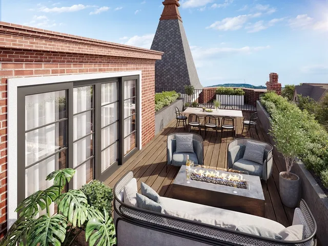 a view of a patio with couches table and chairs with potted plants
