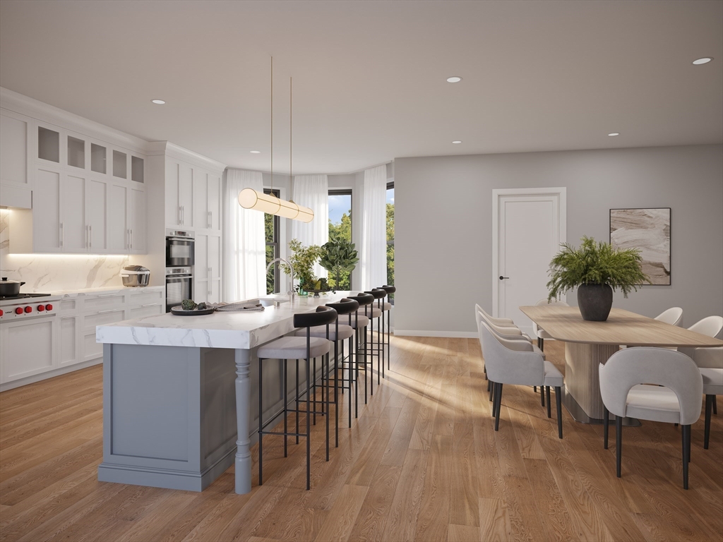 323 Commonwealth Avenue, Unit PH Boston, MA 02115 - Photo 3 of 9 a kitchen with a table and chairs in it