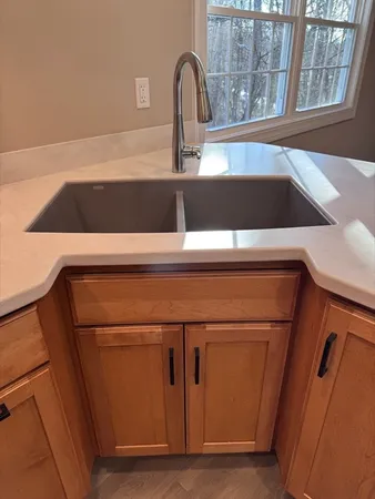 a close view of sink and washing machine