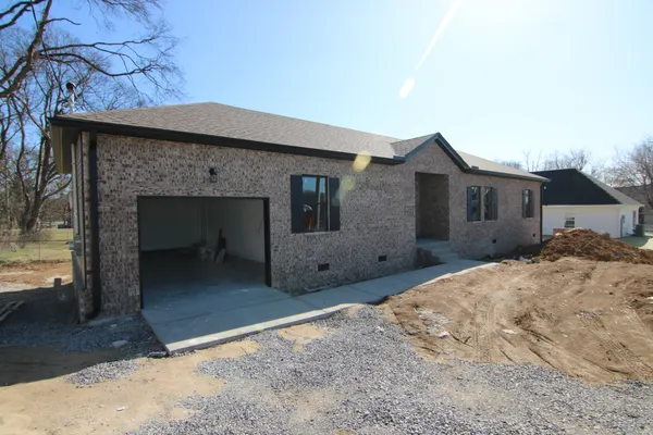 a front view of a house with an empty space