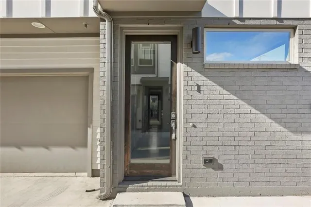 a view of a wooden door of the house
