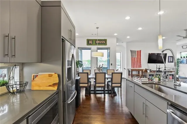 a kitchen with counter space dining table and chairs